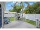 Backyard features a gray wood deck, grill and lush, tropical landscaping at 480 28Th N Ave, St Petersburg, FL 33704