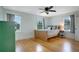 Sunlit bedroom boasts hardwood floors, neutral walls, and two large windows for natural light at 480 28Th N Ave, St Petersburg, FL 33704