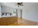 Comfortable bedroom with wood floors features ceiling fan and closet entrance at 480 28Th N Ave, St Petersburg, FL 33704
