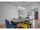 Bright dining room featuring a wooden table, stylish chairs, and pendant lighting at 480 28Th N Ave, St Petersburg, FL 33704
