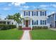 Charming two-story home with a well-maintained lawn, lovely landscaping, and stylish blue shutters at 480 28Th N Ave, St Petersburg, FL 33704
