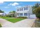 Lovely two-story house with blue shutters, a well-maintained lawn, and concrete driveway at 480 28Th N Ave, St Petersburg, FL 33704