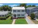 Beautiful two-story home with a well-manicured lawn, complemented by lush landscaping and a spacious driveway at 480 28Th N Ave, St Petersburg, FL 33704