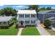 Charming two-story home with blue shutters and a well-manicured lawn at 480 28Th N Ave, St Petersburg, FL 33704