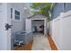 Backyard garage with an open door and a concrete sidewalk at 480 28Th N Ave, St Petersburg, FL 33704