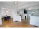 Open-concept living space featuring beautiful hardwood floors with seamless transition to dining and kitchen at 480 28Th N Ave, St Petersburg, FL 33704