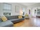 Bright living room featuring a gray sofa, hardwood floors, and neutral tones at 480 28Th N Ave, St Petersburg, FL 33704