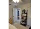 Cozy bedroom featuring stylish decor, with a view into another room through a doorway at 4835 Winslow Beacon # 46, Sarasota, FL 34235