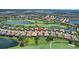 Stunning aerial view of a golf course community featuring beautiful homes and scenic water features at 4931 Benito Ct, Bradenton, FL 34211