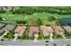 Stunning aerial view of a home nestled in a picturesque golf course community with beautifully landscaped yards at 4931 Benito Ct, Bradenton, FL 34211