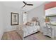 Charming bedroom with a plush rug, decorative pillows, and ample natural light at 4931 Benito Ct, Bradenton, FL 34211
