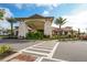 Exterior of the community building with manicured landscaping and covered entrance at 4931 Benito Ct, Bradenton, FL 34211