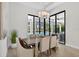 Inviting dining area with backyard views, neutral decor, and modern chandelier at 4931 Benito Ct, Bradenton, FL 34211