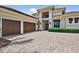 Stunning two-story home showcasing a three-car garage and beautiful stonework at 4931 Benito Ct, Bradenton, FL 34211