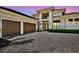 Stunning two-story home showcasing a three-car garage and beautiful stonework at 4931 Benito Ct, Bradenton, FL 34211