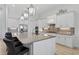 Well-appointed kitchen with a large island, breakfast bar, and stainless steel appliances at 4931 Benito Ct, Bradenton, FL 34211