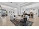 Open concept living room with large sectional sofa, wood look floors, and an eat-in kitchen at 4931 Benito Ct, Bradenton, FL 34211