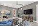 Contemporary living room with stylish furniture, hardwood floors, and access to the outdoor pool area at 4931 Benito Ct, Bradenton, FL 34211