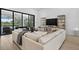 Cozy living room with a large sectional sofa, views of the pool, and stylish decor at 4931 Benito Ct, Bradenton, FL 34211