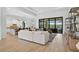 Bright living area with an open floor plan, sliding glass doors, and access to the outdoors at 4931 Benito Ct, Bradenton, FL 34211