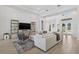 Comfortable living room features wood-look floors, large sectional couch, cabinets, and shelving at 4931 Benito Ct, Bradenton, FL 34211