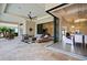 Spacious outdoor living area with a dining area, seating, and seamless indoor/outdoor flow at 4931 Benito Ct, Bradenton, FL 34211