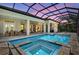 A screened-in pool with an attached spa provides a serene outdoor retreat at 4931 Benito Ct, Bradenton, FL 34211