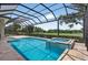 A screened-in pool with an attached spa provides a serene outdoor retreat at 4931 Benito Ct, Bradenton, FL 34211