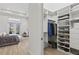 This walk-in closet adjacent to the primary bedroom features extensive shelving and hanging space at 4931 Benito Ct, Bradenton, FL 34211