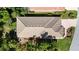 Overhead view of a home with a tile roof, highlighting the well-maintained yard and surrounding green landscape at 5018 Hanging Moss Ln, Sarasota, FL 34238