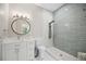 Stylish bathroom featuring vanity, toilet, wall mirror, and shower with contemporary fixtures at 5018 Hanging Moss Ln, Sarasota, FL 34238