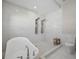 Sleek bathroom featuring a soaking tub, walk-in shower, and modern fixtures at 5018 Hanging Moss Ln, Sarasota, FL 34238