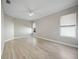 Spacious bedroom with hardwood flooring, a ceiling fan, and plenty of natural light at 5018 Hanging Moss Ln, Sarasota, FL 34238