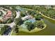 Aerial view of community amenities: pool, tennis courts, basketball court, and lush landscaping at 5018 Hanging Moss Ln, Sarasota, FL 34238