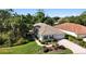 Beautiful single story home with lush landscaping and a paver driveway is nestled in a mature tree lined community at 5018 Hanging Moss Ln, Sarasota, FL 34238