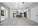 Open concept kitchen with stainless appliances, an island, and ample space for dining and gathering at 5018 Hanging Moss Ln, Sarasota, FL 34238