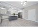 This spacious kitchen features stainless steel appliances, an island, and modern lighting at 5018 Hanging Moss Ln, Sarasota, FL 34238