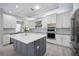 Stylish kitchen featuring granite countertops, stainless steel appliances, and custom cabinetry at 5018 Hanging Moss Ln, Sarasota, FL 34238