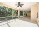 Large screened-in lanai with ceiling fans providing a comfortable outdoor space at 5018 Hanging Moss Ln, Sarasota, FL 34238