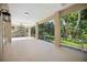 Spacious screened-in lanai offering views of a lush backyard at 5018 Hanging Moss Ln, Sarasota, FL 34238