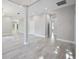 Spacious open-plan living room boasts tile floors, recessed lighting, and neutral walls at 5018 Hanging Moss Ln, Sarasota, FL 34238