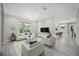 Cozy living room with modern furnishings and a decorative chandelier at 5018 Hanging Moss Ln, Sarasota, FL 34238