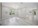 Spacious room with neutral decor, hardwood floors, and natural light at 5018 Hanging Moss Ln, Sarasota, FL 34238