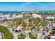Aerial view features a landscaped roundabout, coastal buildings and beautiful water views at 510 Wedge Ln, Longboat Key, FL 34228