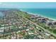 High-angle view of houses along canals with boat docks near beaches, resorts, and lush vegetation at 510 Wedge Ln, Longboat Key, FL 34228