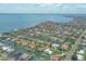High-angle view showcasing houses near canals with boats, docks, palm trees, and lush vegetation at 510 Wedge Ln, Longboat Key, FL 34228