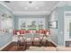 Elegant dining area with custom window seating and hardwood floors at 510 Wedge Ln, Longboat Key, FL 34228