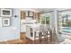 Gourmet kitchen with island, white countertops, and stainless steel hood at 510 Wedge Ln, Longboat Key, FL 34228
