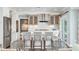 A modern kitchen island with seating and stainless appliances at 510 Wedge Ln, Longboat Key, FL 34228