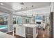 Kitchen island with stainless appliances, and breakfast bar at 510 Wedge Ln, Longboat Key, FL 34228